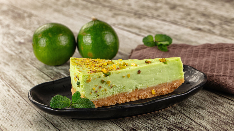 mint cheesecake served with limes