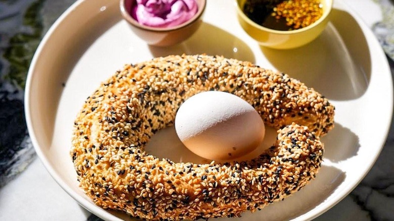Ka'ak bagel with hard boiled egg and sauces