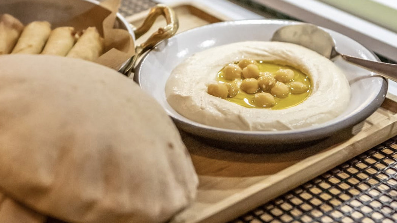 Hummus with chickpeas and olive oil and pita bread