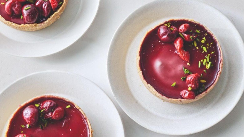 Custard pies on small white plates