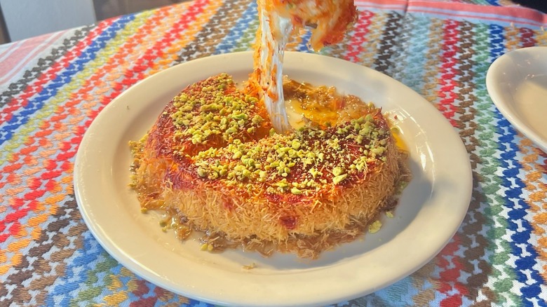 A middle eastern pastry dessert with sweet cheese on plate