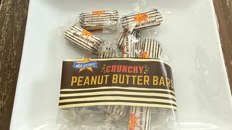 Crunchy Peanut Butter Bars spilling out of the package onto a white plate