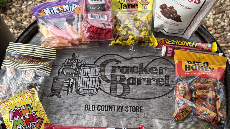 variety of classic candies on top of a Cracker Barrel branded barrel