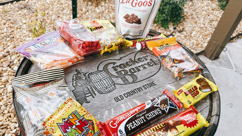 variety of classic candies on top of a Cracker Barrel branded barrel