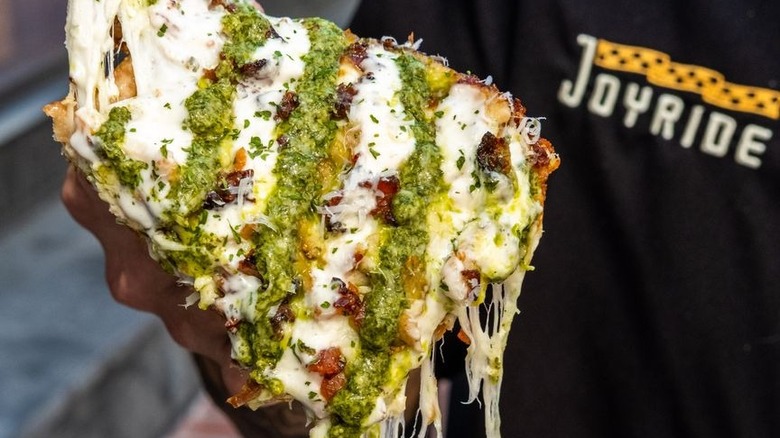 Cheesy dropping pizza