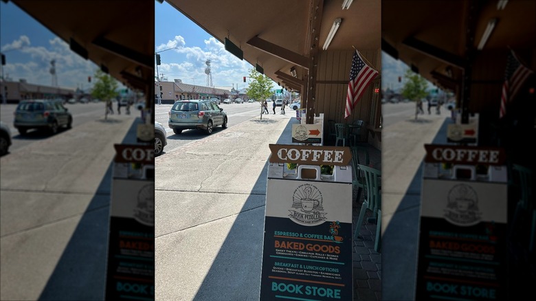 Book Peddler & Coffee Cafe @ Book Peddler exterior sidewalk with sign