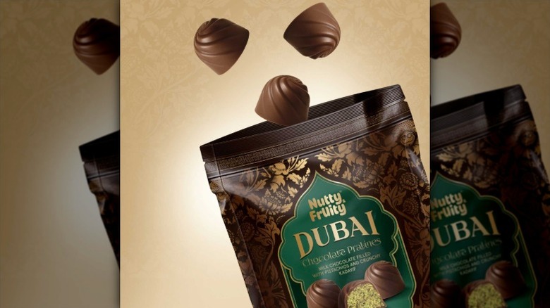 Dubai chocolate truffles floating out of a bag