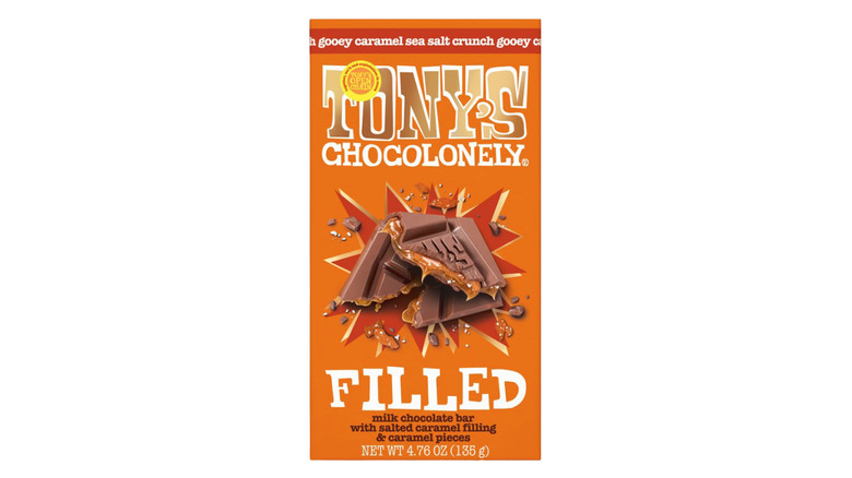 Tony's Chocolonely Filled Gooey Caramel Sea Salt Crunch milk chocolate bar on white background