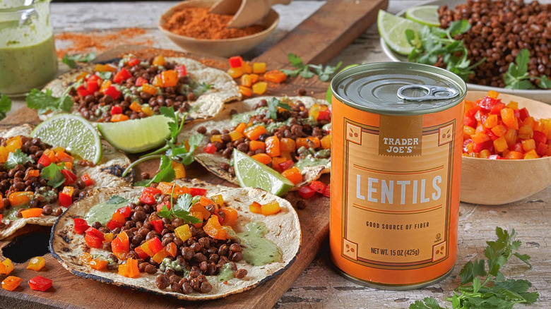 A can of Trader Joe's lentils next to freshly made lentil and veggie tacos