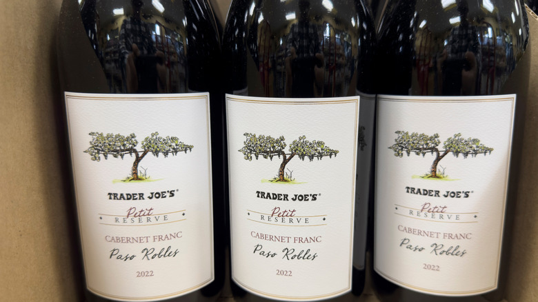 A close-up shot of three bottles of Trader Joe's wine