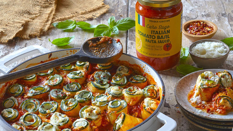 A baked pasta dish made with Caro Sugo Italian Tomato Basil Pasta Sauce from Trader Joe's, styled with the jar and ingredients