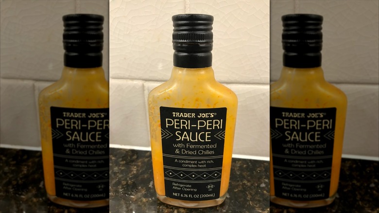 Half-used bottle of Trader Joe's Peri-Peri sauce on kitchen countertop