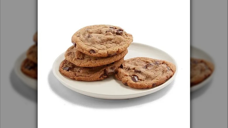 A plate of chocolate chip cookies on a white background