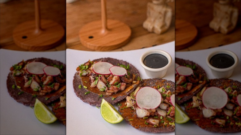 Two open face tacos on plate