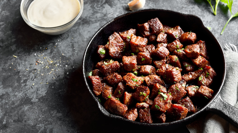 Garlic butter steak bites in cast iron pan