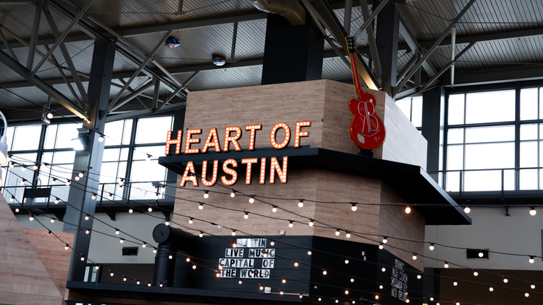 Heart of Austin food hall sign above string lights at Austin-Bergstrom International Airport