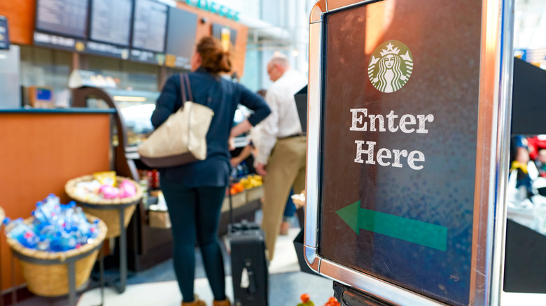 Enter Here sign for counter line at a Starbucks location at Chicago O'Hare International Airport