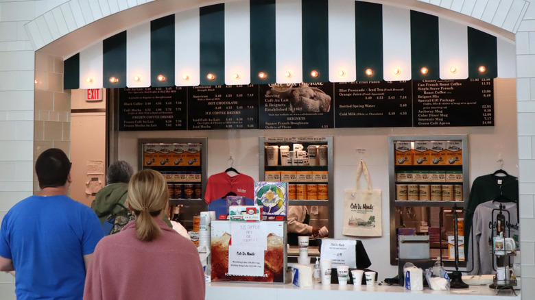 Guests wait in line at Cafe du Monde location in Louis Armstrong New Orleans International Airport