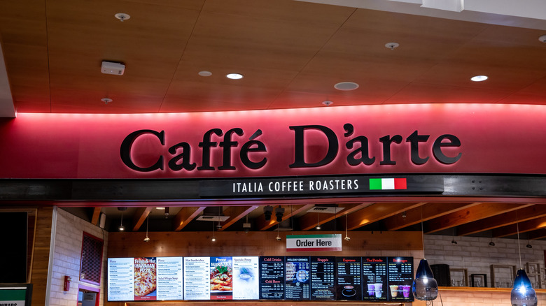 Caffe D'arte coffee shop with store sign and menu inside Seattle-Tacoma International Airport