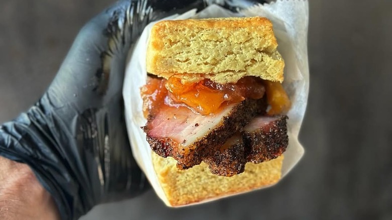 Brisket and jam topping in a biscuit sandwich