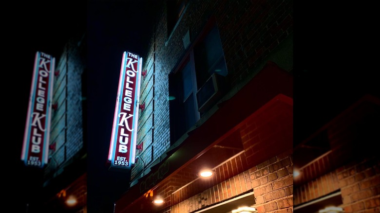 Kollege Klub Wisconsin exterior with neon sign lit at night