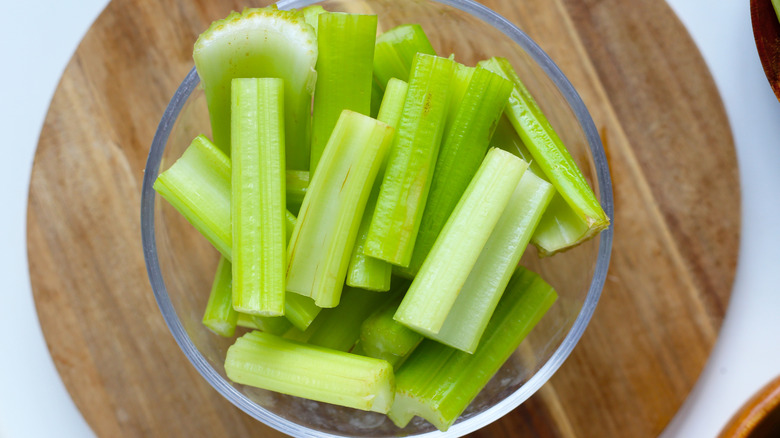 a bowl of cut pieces of celery
