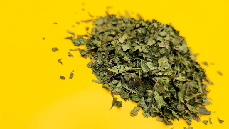 Dried parsley on a yellow background
