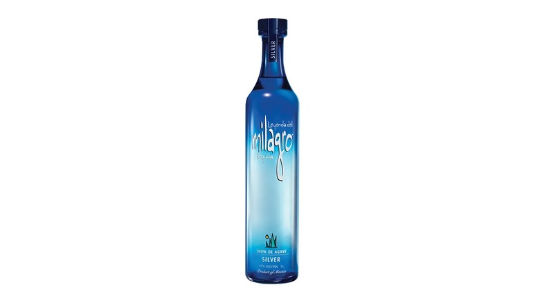 A bottle of Milagro Silver tequila on a white background.