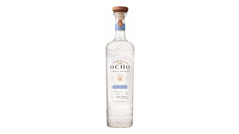 Bottle of Tequila Ocho Plata on a white background.