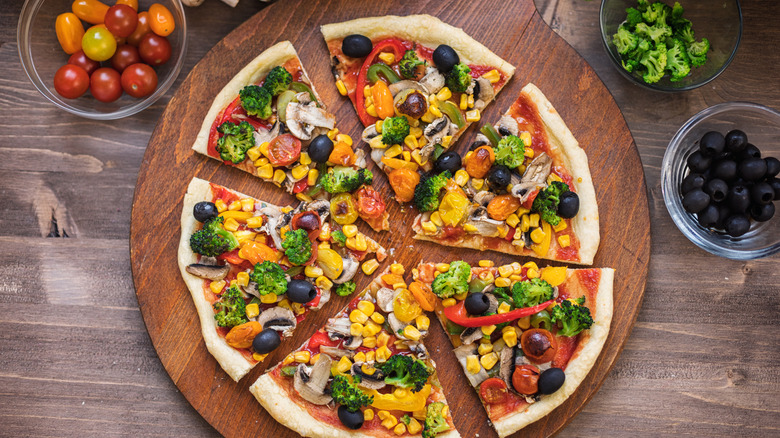 A homemade pizza topped with various vegetables