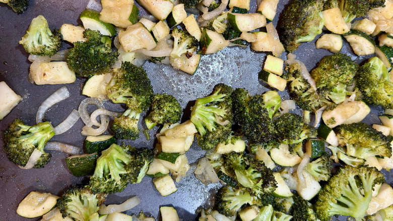 Roasted broccoli and other vegetables on a pan