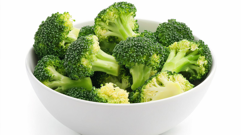 Cooked broccoli in a white bowl