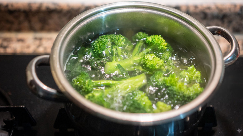 Broccoli boiling in a pot of water