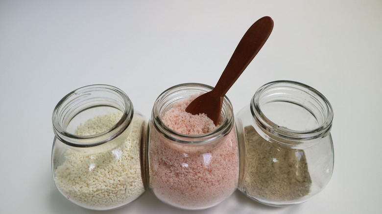 Three jars of salt, pepper, and seasonings