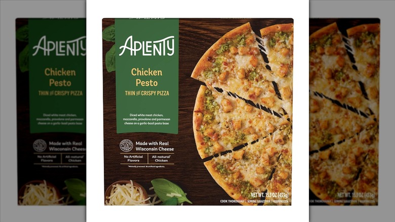 Aplenty Chicken Pesto Thin and Crispy Pizza in cardboard packaging on a white background.