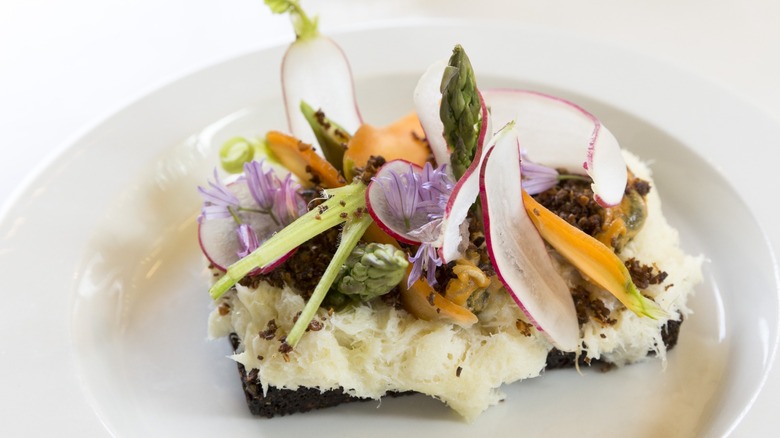 A Smorrebrod, a Nordic open sandwich served on minimalist white china plate - in Denmark