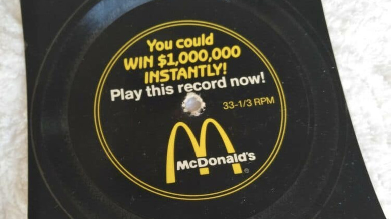 A closeup of a McDonald's menu song record with contest advertisement text