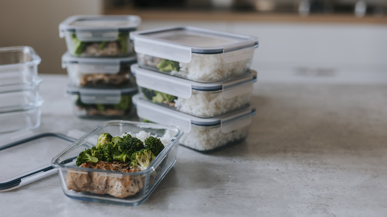 Stacks of lunchboxes representing food prep