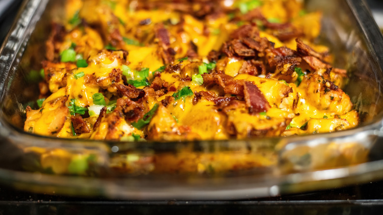 Potatoes, bacon, and cheese in casserole dish