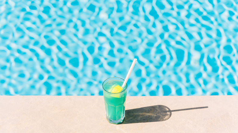 tropical blue beverage and pool