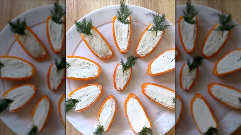 Mini orange bell pepper carrots garnished with dill sprigs