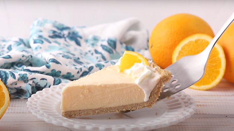 Orange icebox pie slice on spatula