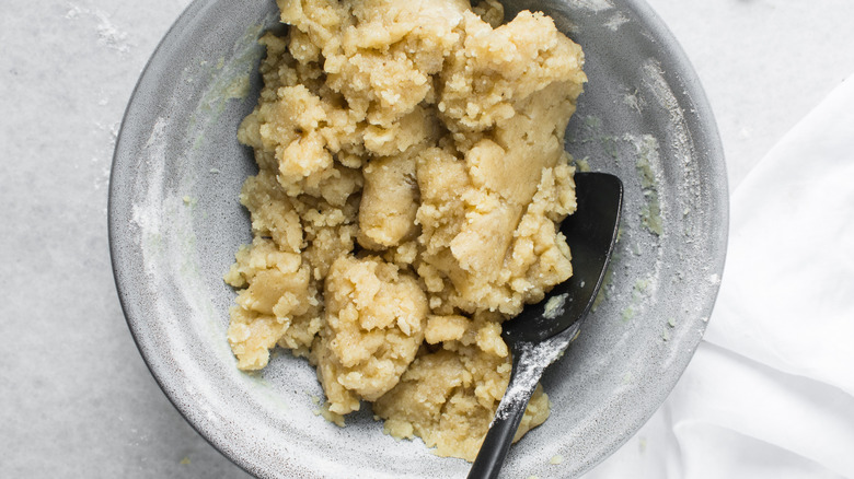raw cookie dough in gray bowl