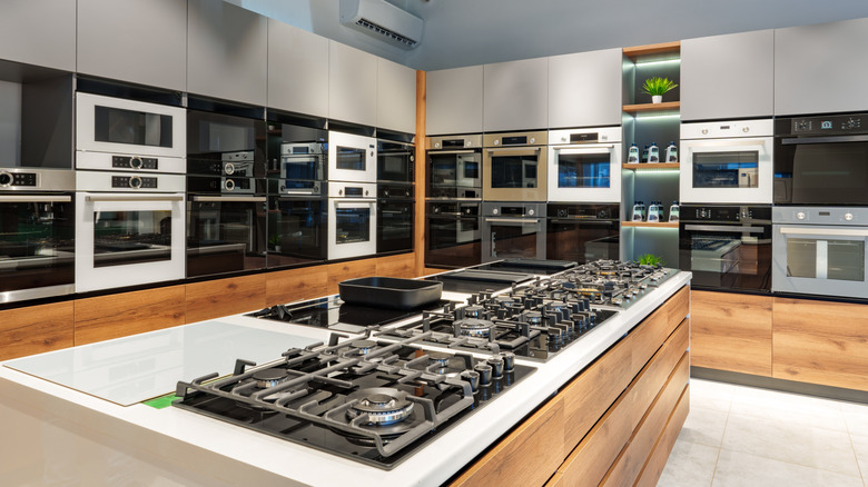 Interior of premium home appliance store in a mall in the oven and cooktop display section