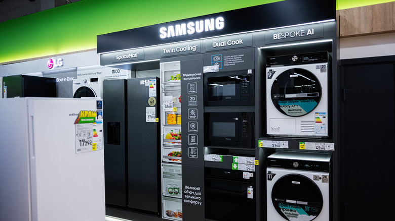 A variety of advanced kitchen and laundry appliances are arranged in Samsung electronic store.