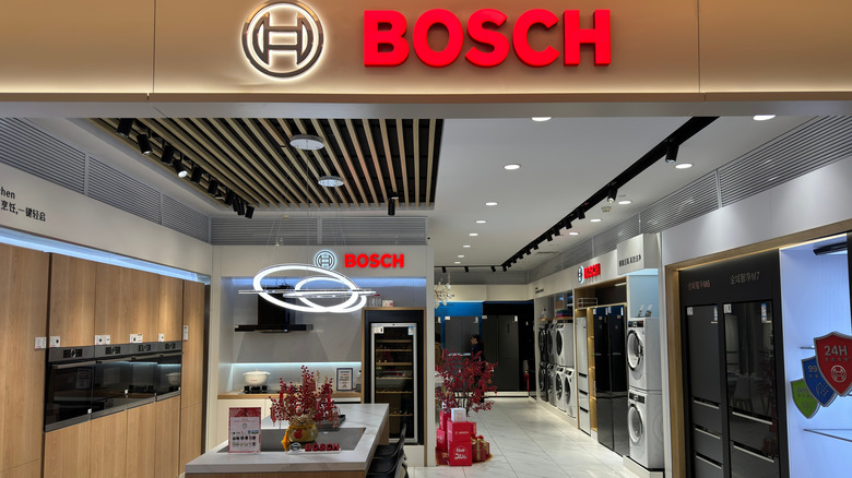 Bosch home appliance store featuring wall ovens, refrigerators, and washing machines
