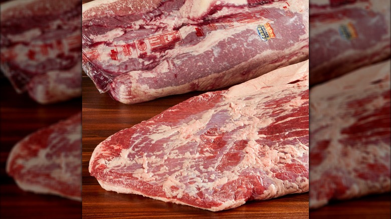 Two large Prime briskets from Costco on a wooden surface