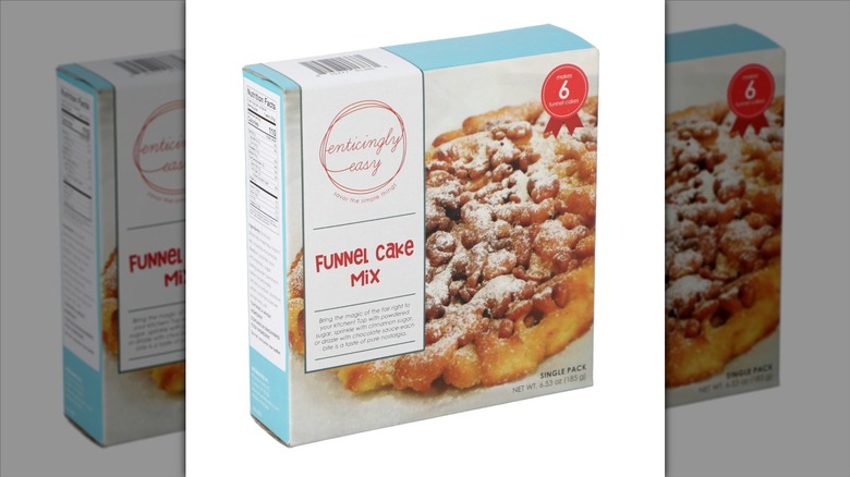 A box of Enticingly Easy Funnel Cake Mix on a white background.