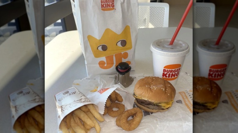 Burger King kids meal with burger, onion rings, fries, drink, and toy