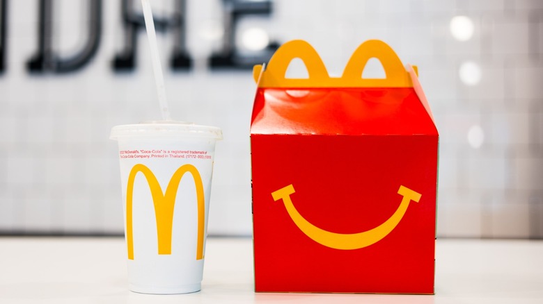 McDonald's drink cup and red happy meal box